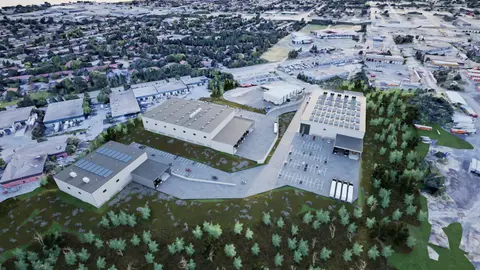 Aerial rendering of the industrial park on its wooded hillside, with Sudbury's neighbourhoods and industrial area beyond