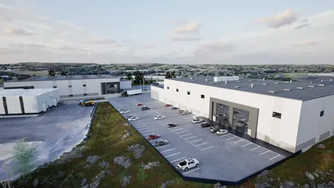 Rendering of one of the new industrial buildings and its parking lot, with a glazed two-storey entrance