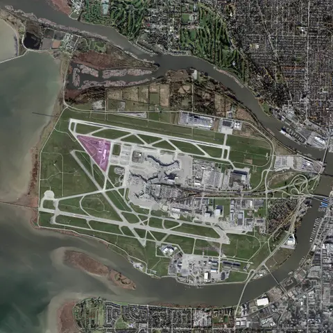 Satellite map of Vancouver International Airport on Sea Island, with the building's site highlighted between the runways